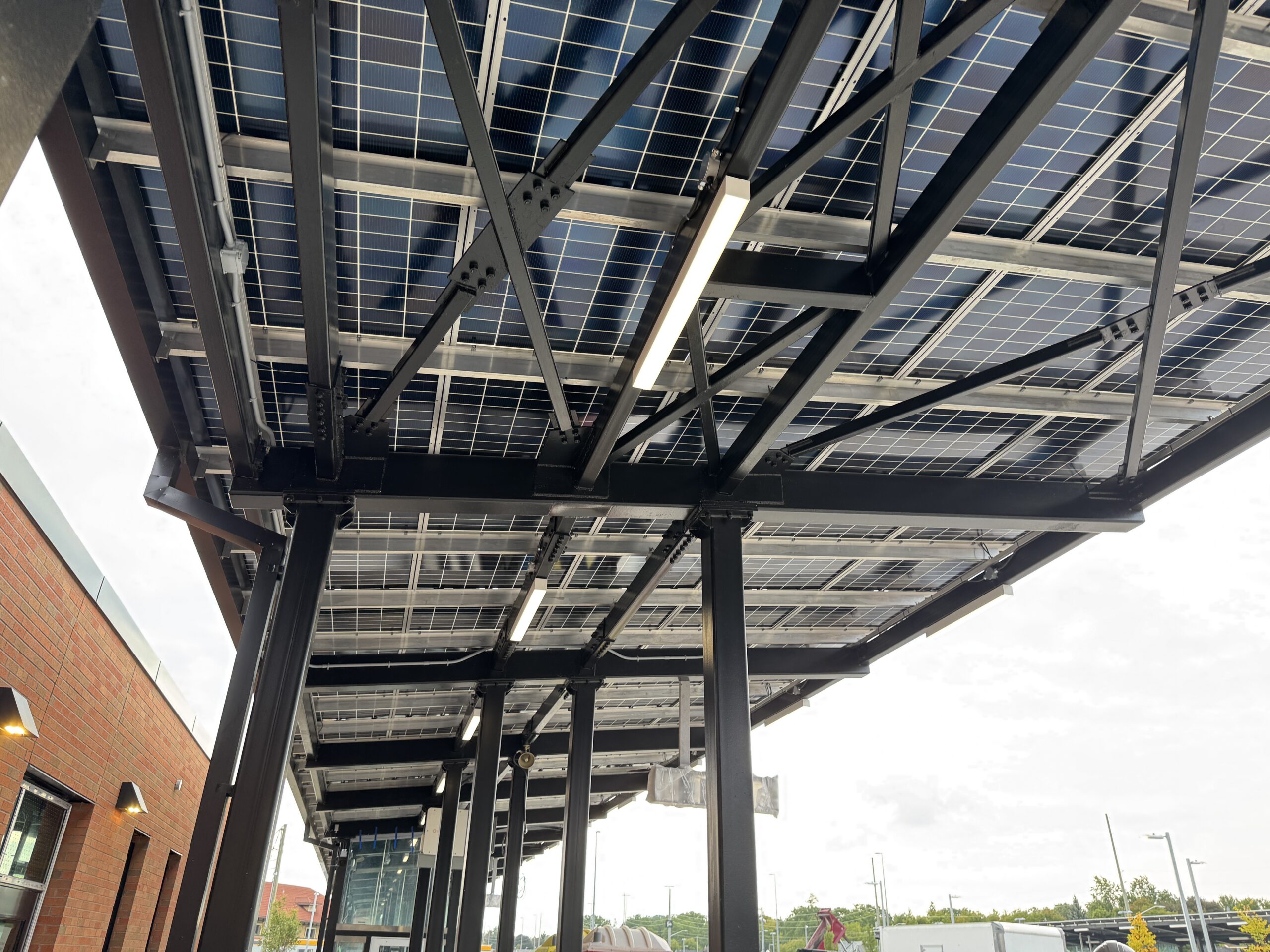 Steel bus shelter frame with bolted connections designed for strength and durability