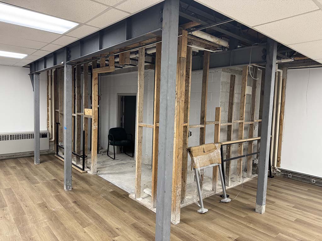 Steel framing system designed to support heavy bank vault and ATM loads within an existing building